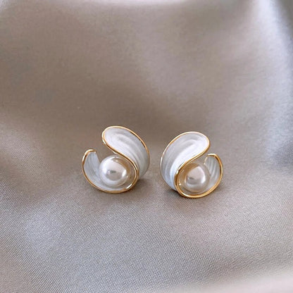 Elegant gold earrings with shining white opal and fine pearl