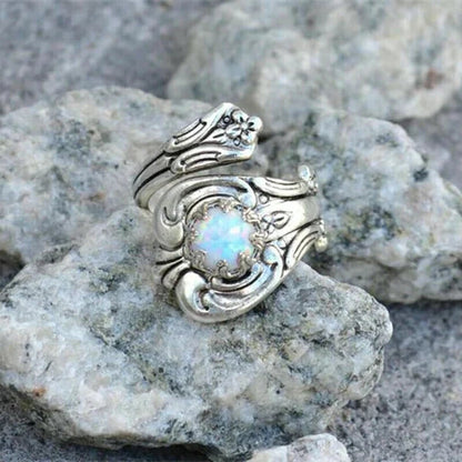 Elegant adjustable ring with a radiant white opal spoon