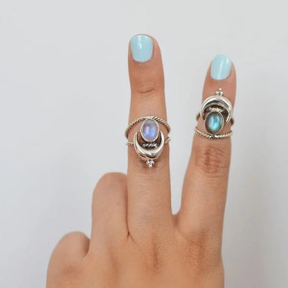 Captivating Oval Rainbow Moonstone Ring with Moon Phases Design