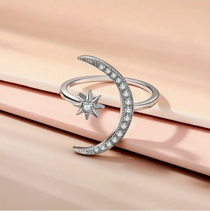 Elegant silver ring with sparkling moon & star diamond design