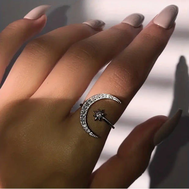 Elegant silver ring with sparkling moon & star diamond design