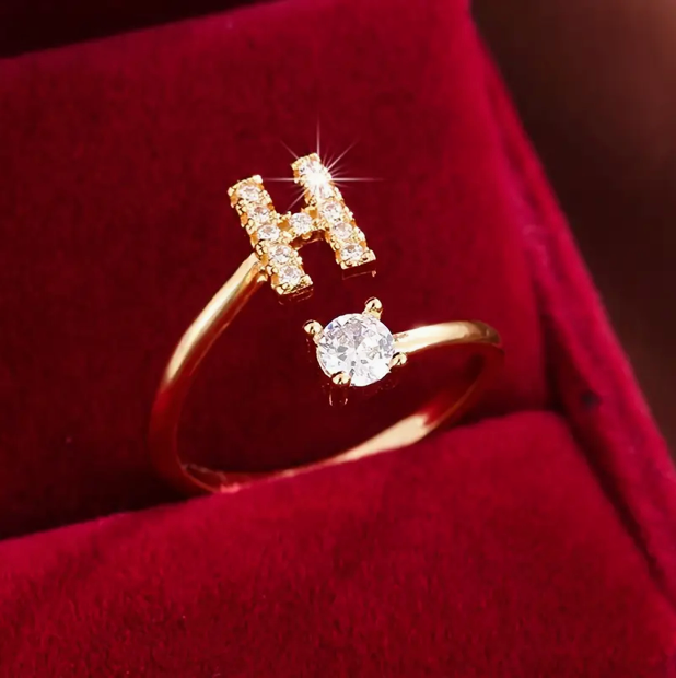 Elegant diamond letter ring made of gold and silver