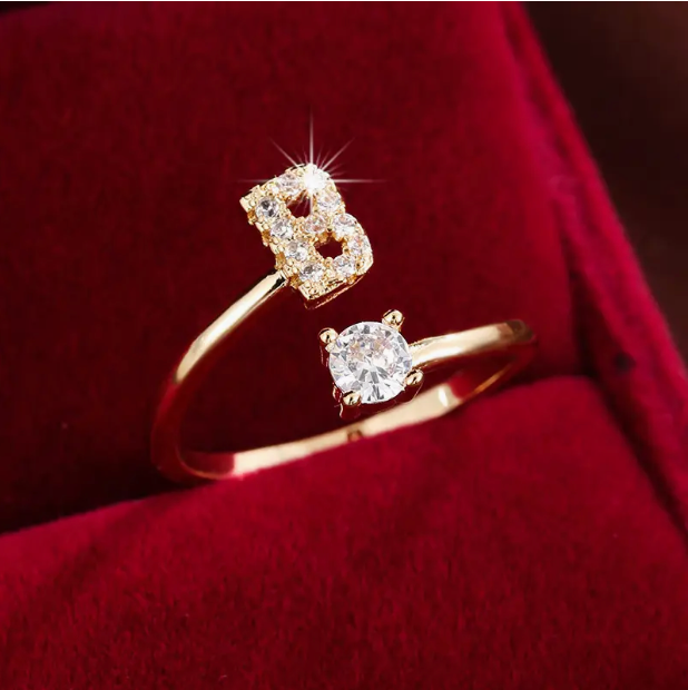 Elegant diamond letter ring made of gold and silver