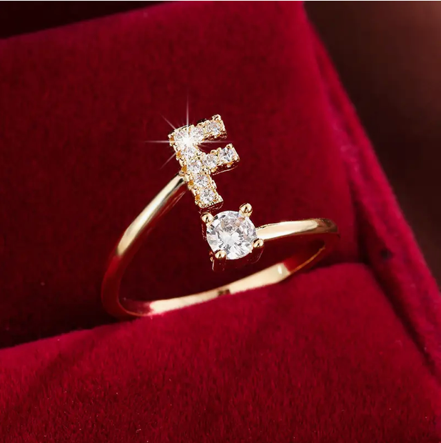 Elegant diamond letter ring made of gold and silver