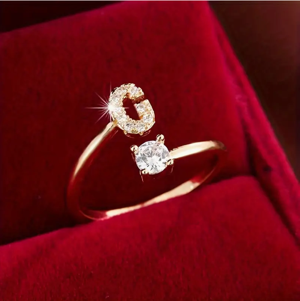 Elegant diamond letter ring made of gold and silver