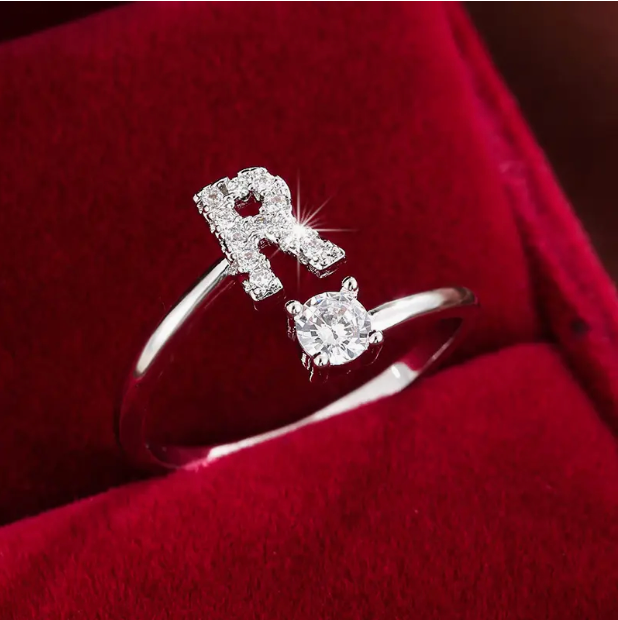 Elegant diamond letter ring made of gold and silver