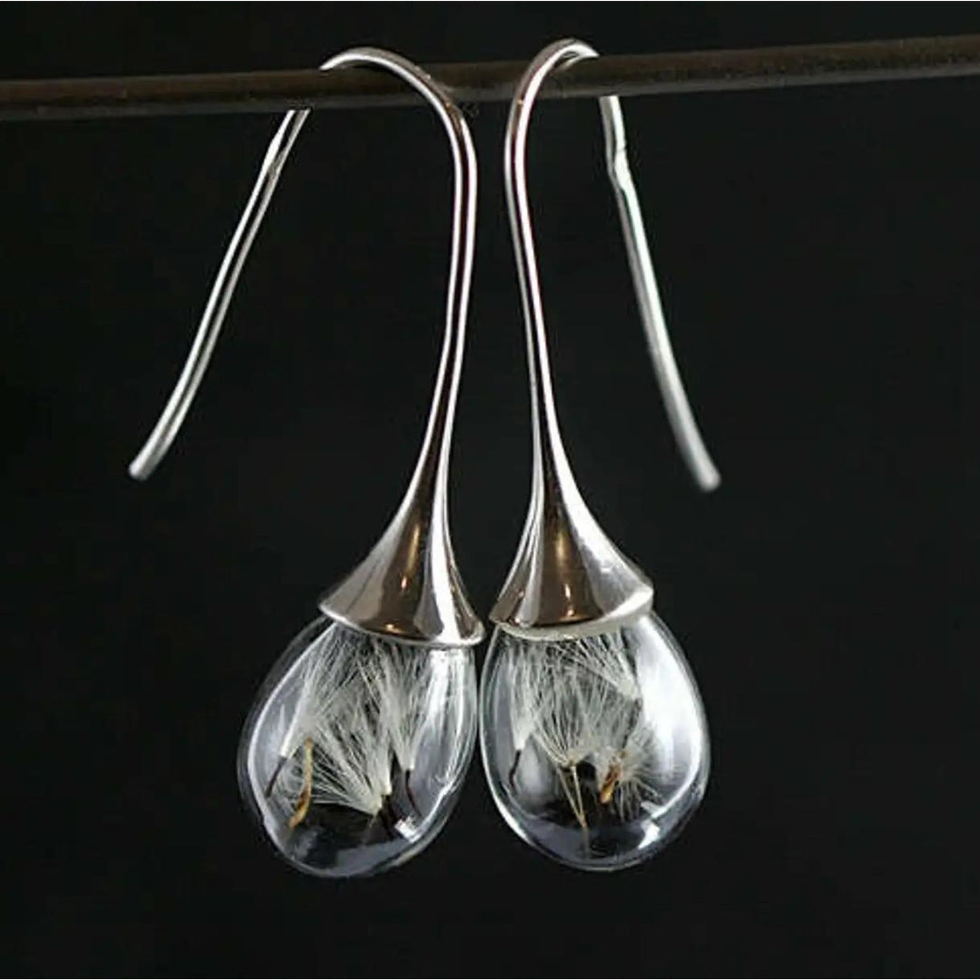 Elegant silver earrings with dandelion pendants