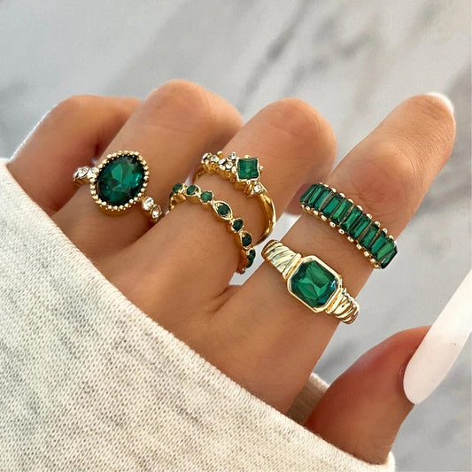 Elegant gold rings with sparkling green zircons