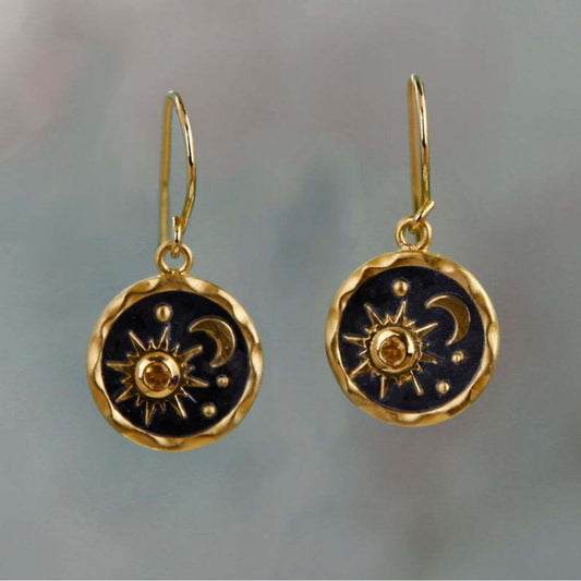 Fascinating earrings with radiant sun and mysterious moon design in elegant gold and silver