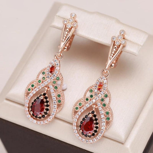 Elegant red mandala earrings with sparkling zirconia in noble gold