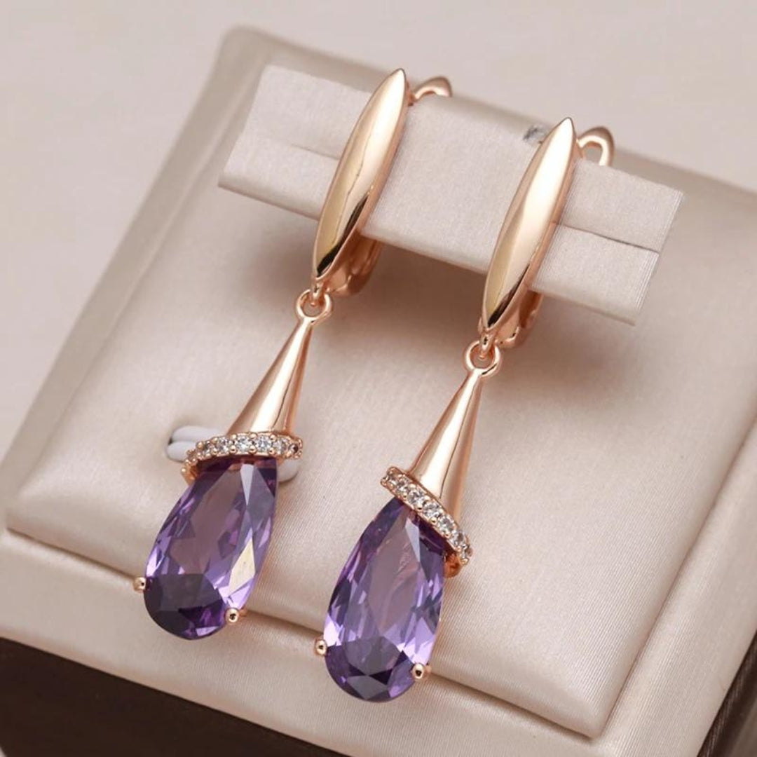 Elegant gold earrings with sparkling purple zirconia