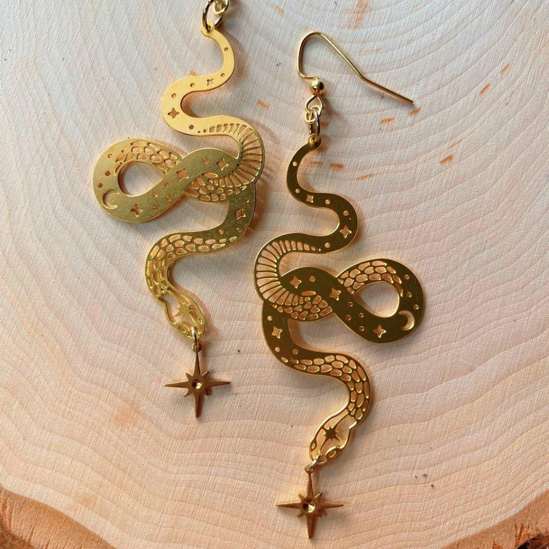 Elegant gold earrings with star snake pendant