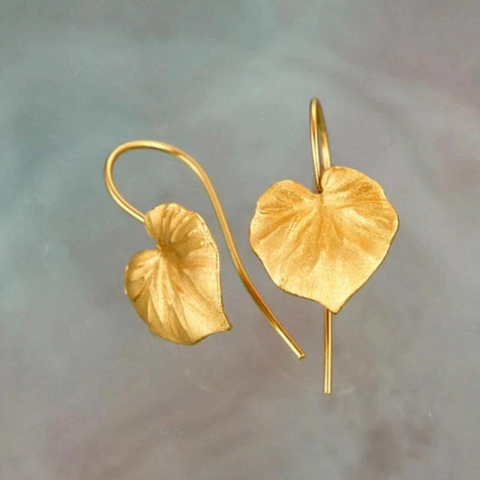 Elegant earrings with golden leaf design