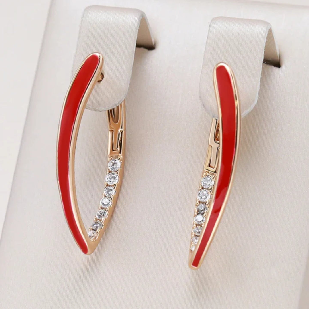 Elegant gold-plated earrings with vibrant red enamel accent