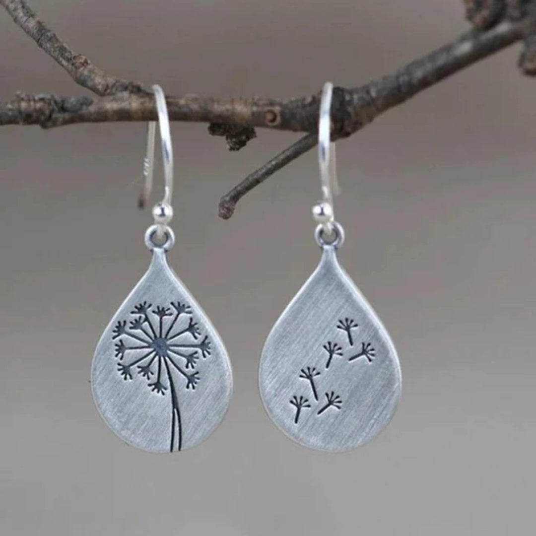 Elegant silver-plated earrings with dandelion design