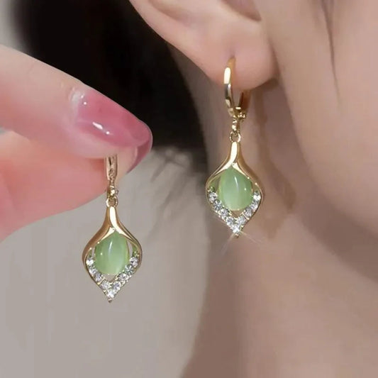 Glamorous earrings with radiant green crystals