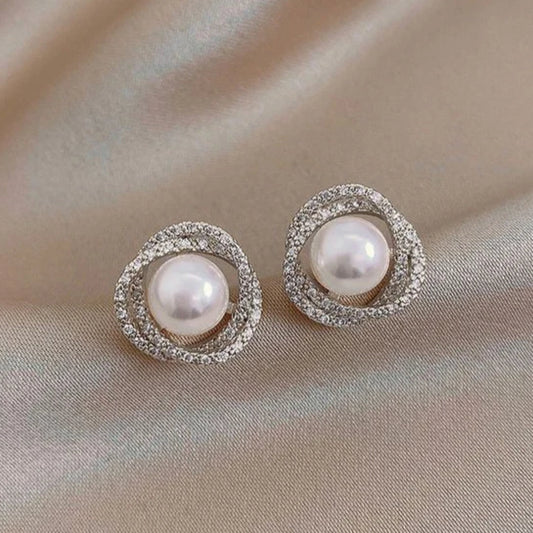 Fascinating spiral earrings with stylish pearl accents