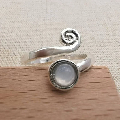 Elegant spiral ring with radiant vintage moonstone