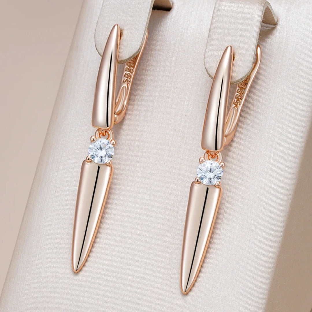 Elegant gold earrings with shimmering tip