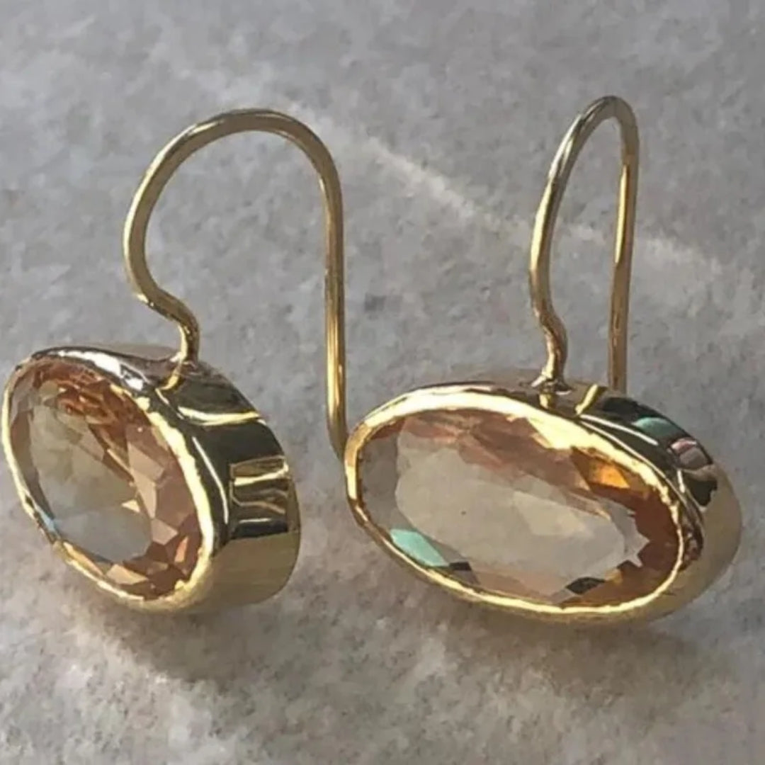 Sparkling gold earrings with crystal inlays