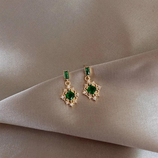 Stylish gold earrings with dazzling green zirconia stones