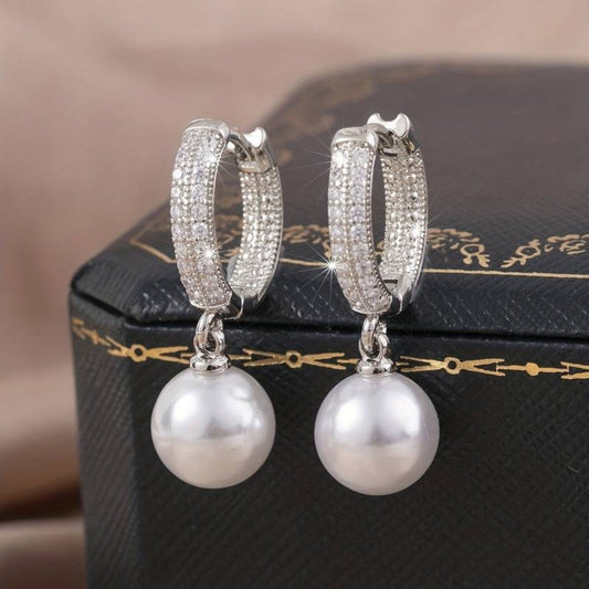 Stylish silver earrings with shimmering pearls