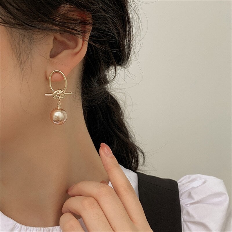 Elegant gold earrings with pearl accents