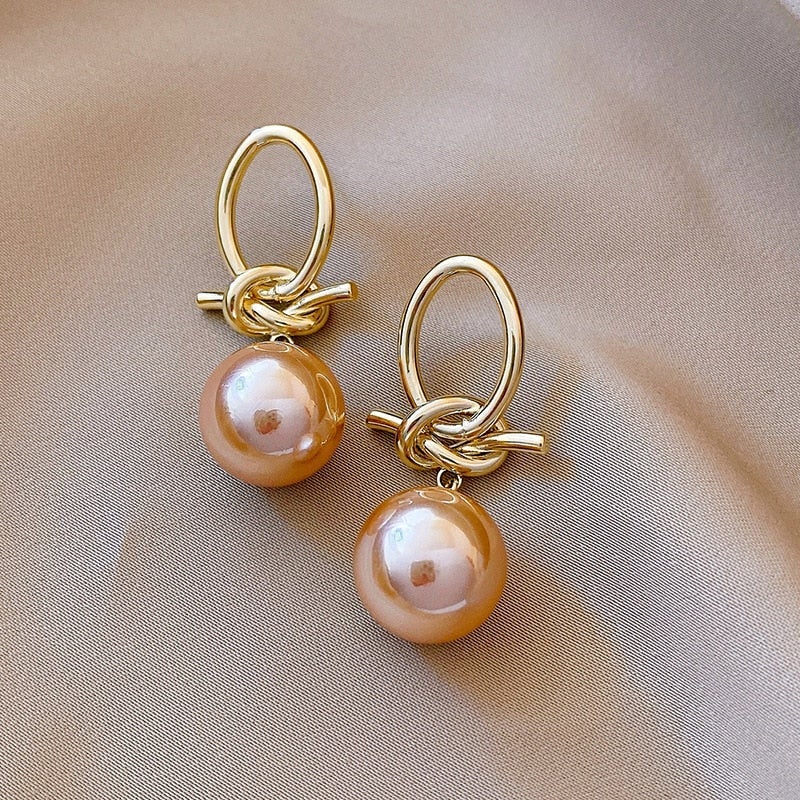 Elegant gold earrings with pearl accents