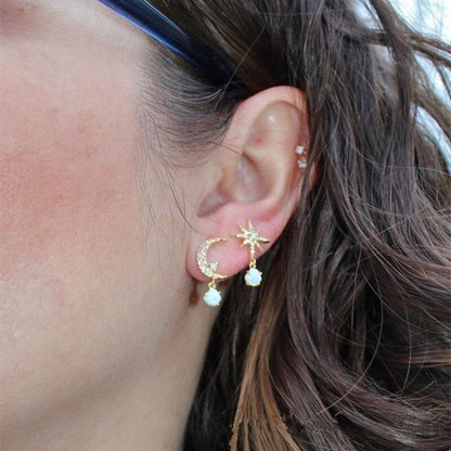 Elegant gold and opal earrings with crescent and star-shaped design