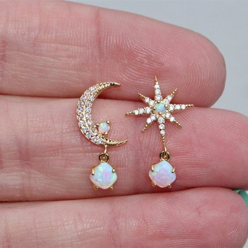 Elegant gold and opal earrings with crescent and star-shaped design