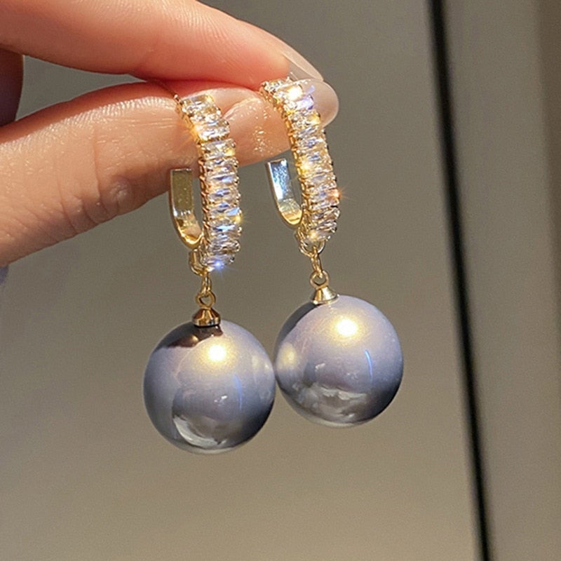 Elegant pearl earrings with sparkling zirconia