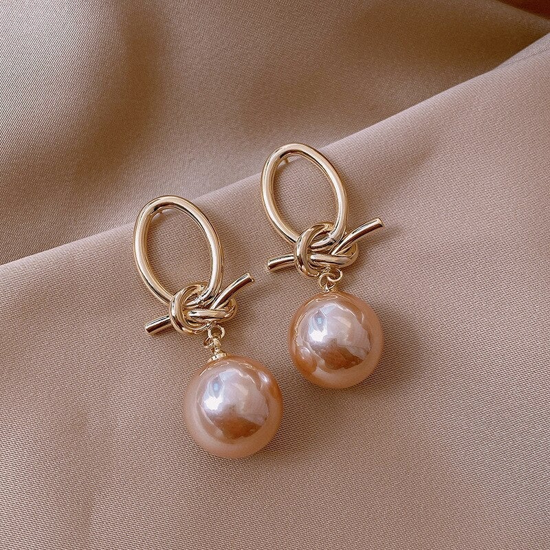 Elegant gold earrings with pearl accents