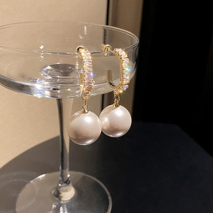 Elegant pearl earrings with sparkling zirconia