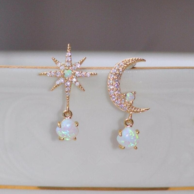 Elegant gold and opal earrings with crescent and star-shaped design