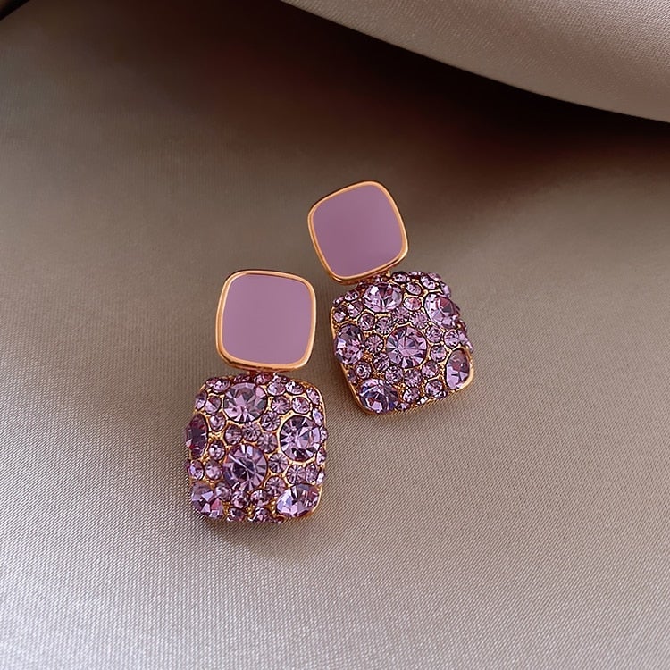 Elegant purple earrings with sparkling zirconia decoration