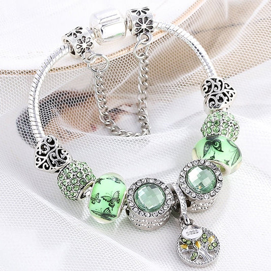 Elegant sterling silver bracelet with radiant green crystal