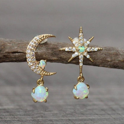 Elegant gold and opal earrings with crescent and star-shaped design