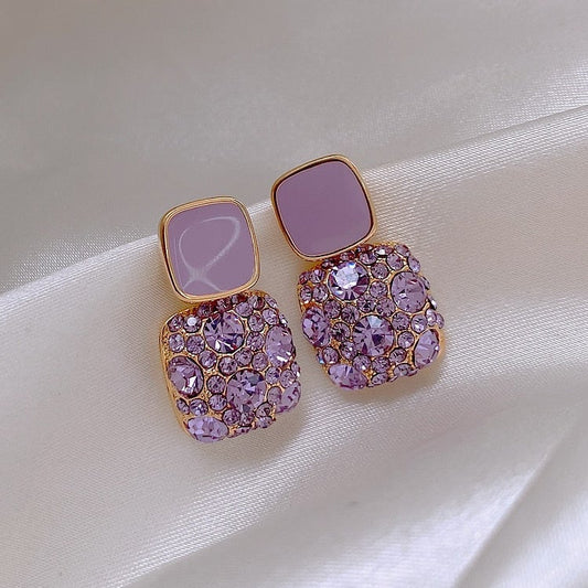 Elegant purple earrings with sparkling zirconia decoration