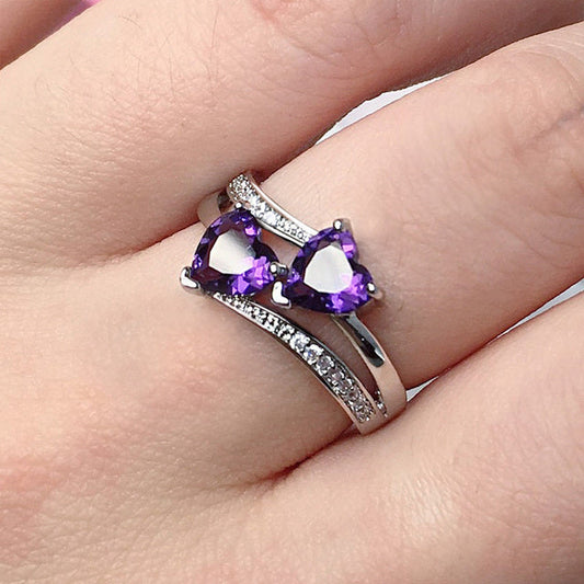 Elegant silver ring with sparkling purple crystal