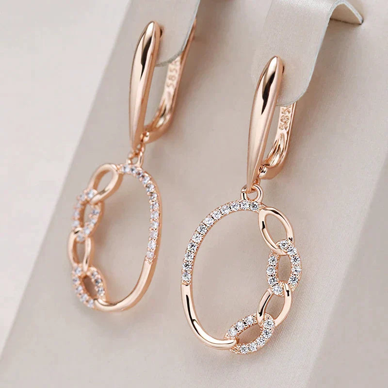 Stylish earrings with sparkling gold cubic zirconia