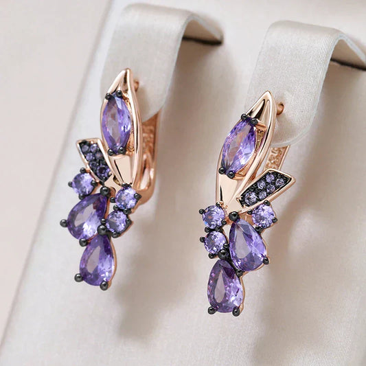 Luxurious gold earrings with sparkling purple zirconia