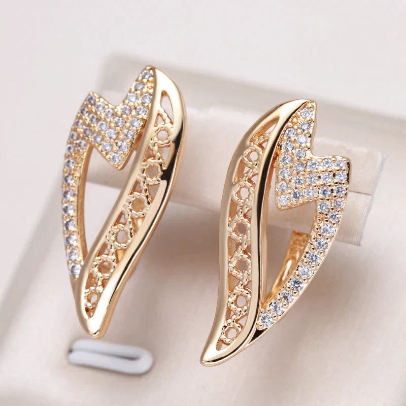 Antique-inspired golden earrings with sparkling zirconia stones