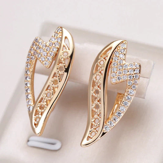 Antique-inspired golden earrings with sparkling zirconia stones