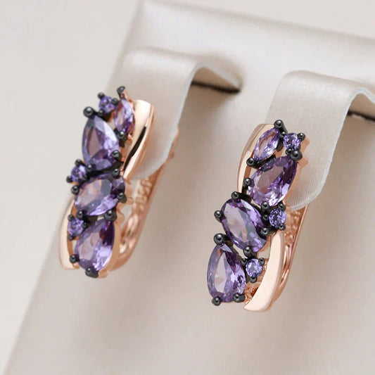 Stylish gold earrings with delicate purple crystal