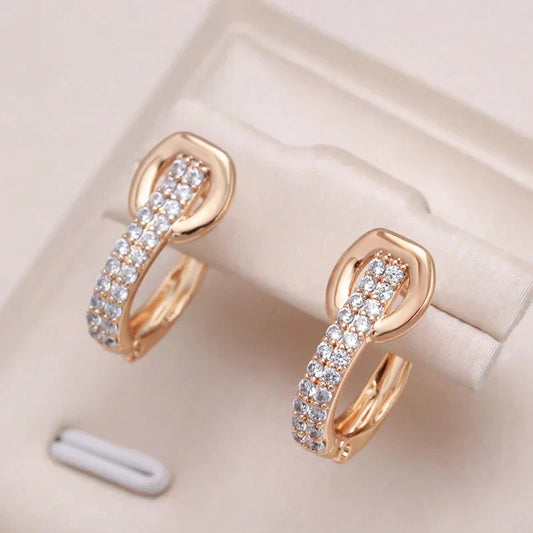 Fascinating gold earrings with radiant zirconia inlay