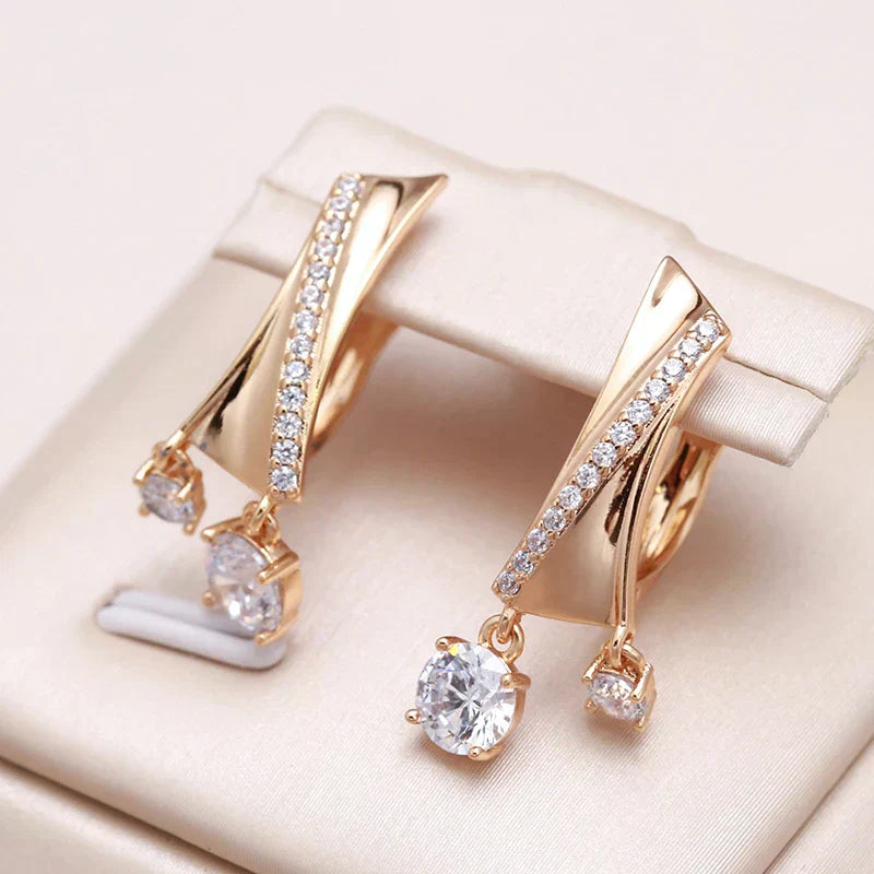 Stylish gold drop earrings with sparkling zirconia stones