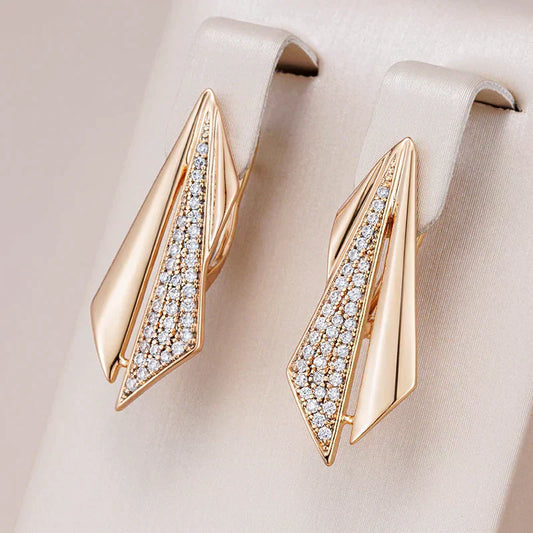 Fascinating golden earrings with sparkling zirconium