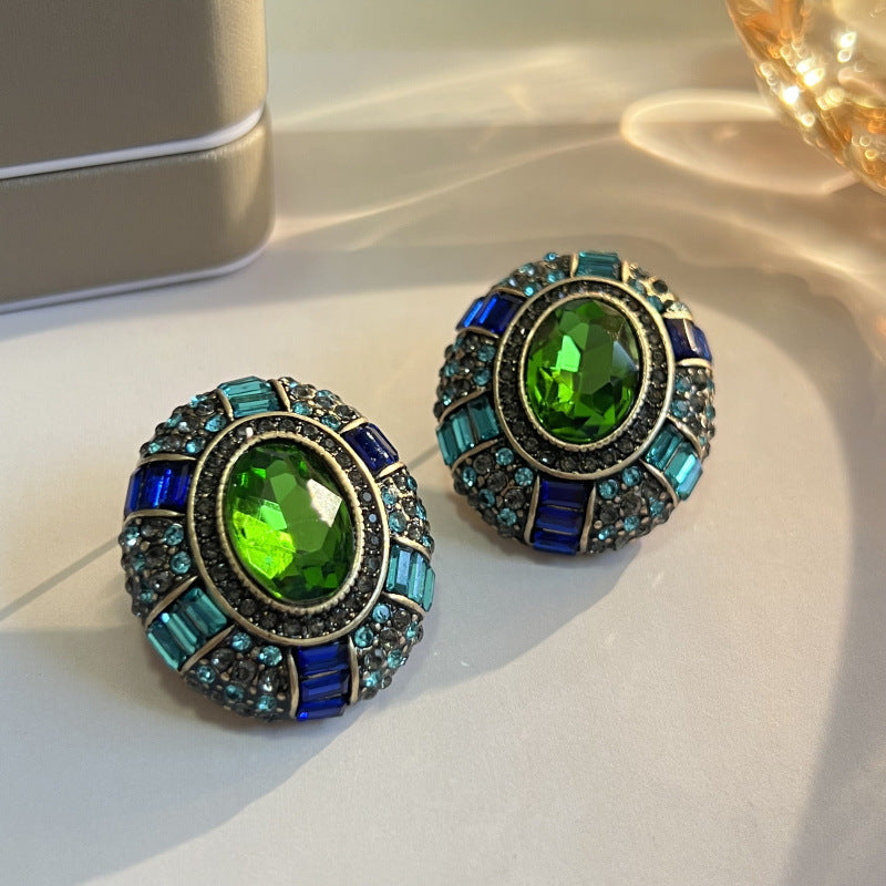 Beautiful vintage earrings with sparkling green crystal and radiant blue cubic zirconia