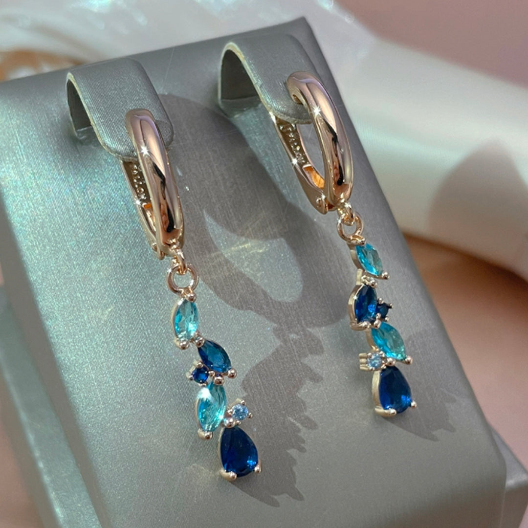 Enchanting earrings with blue and golden crystals