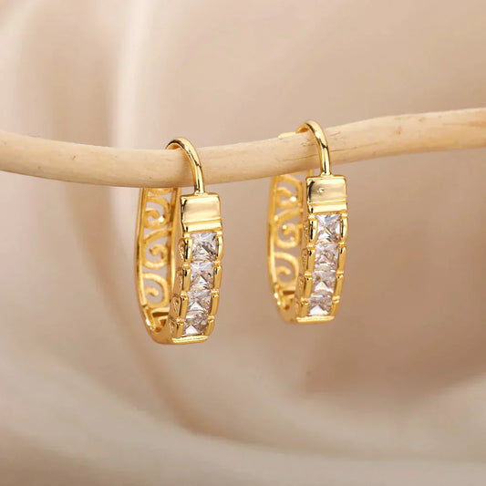 Elegant gold earrings with minimalist zirconia hollow design